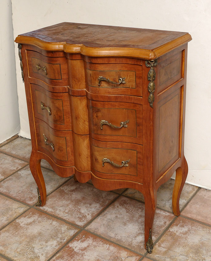 Appraisal: DIMINUTIVE SERPENTINE FRONT FRENCH COMMODE Ormolu mounted three drawer chest