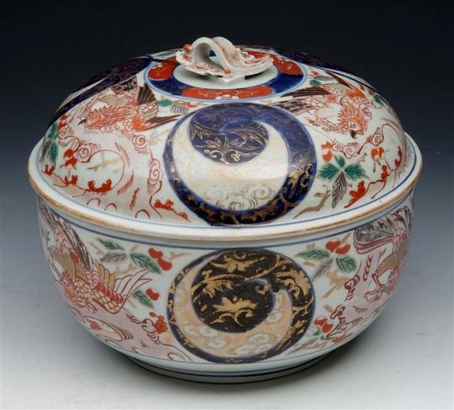 Appraisal: A JAPANESE IMARI ROUND TUREEN AND COVER decorated griffin-like birds