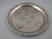 Appraisal: A small Chinese silver salver with stiffening rim the matted