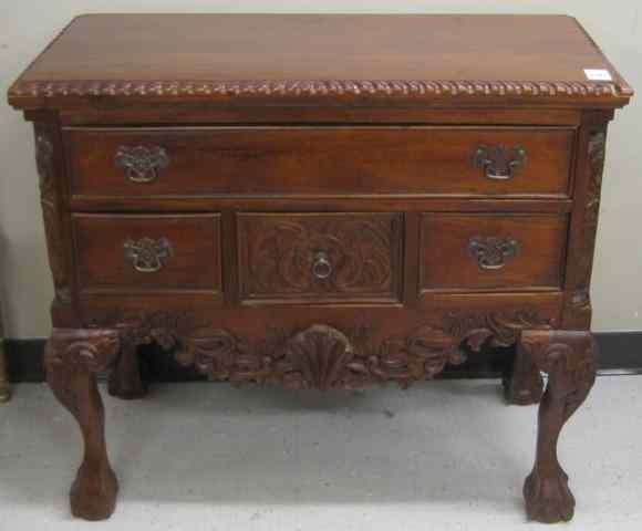 Appraisal: CHIPPENDALE STYLE CARVED MAHOGANY LOWBOY the front featuring one large