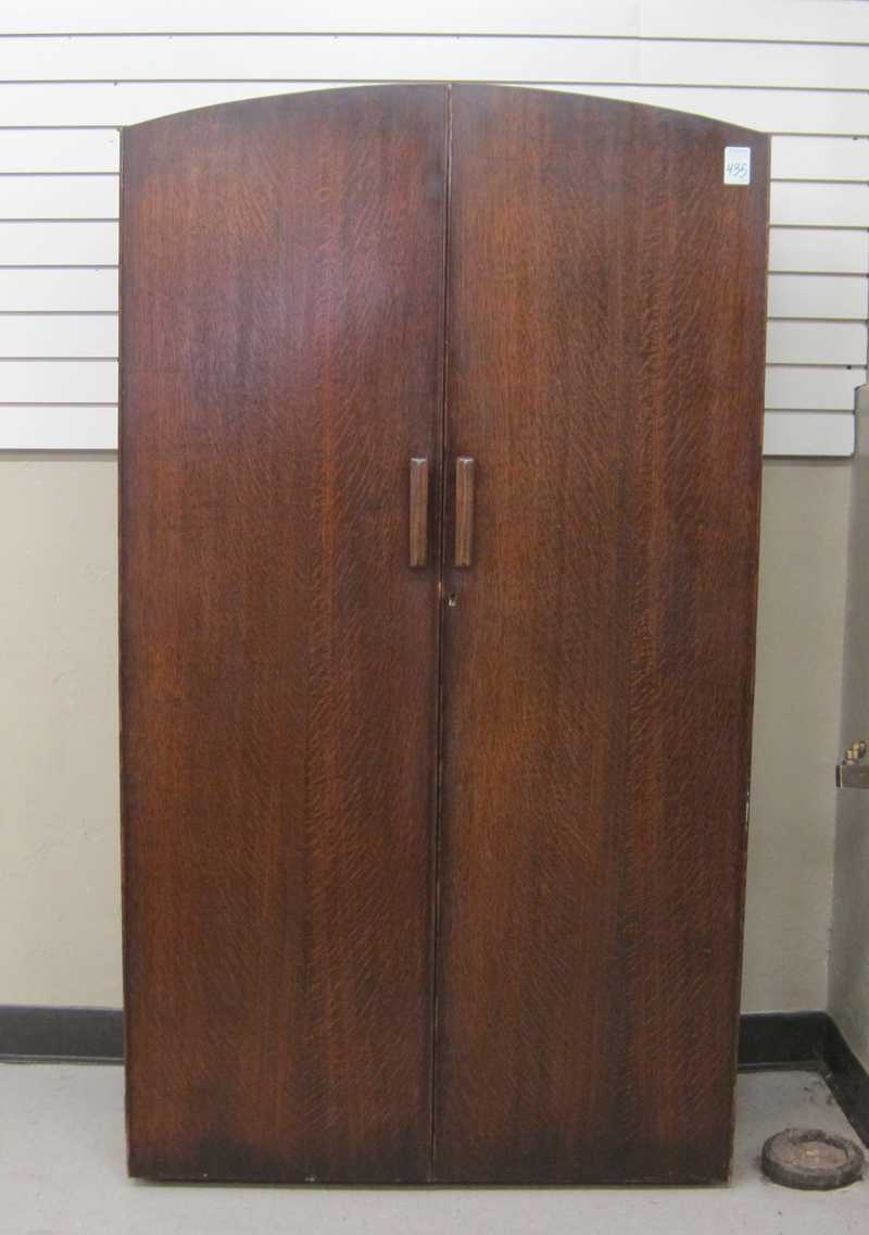 Appraisal: TWO-DOOR OAK WARDROBE English mid- th century having a hanger