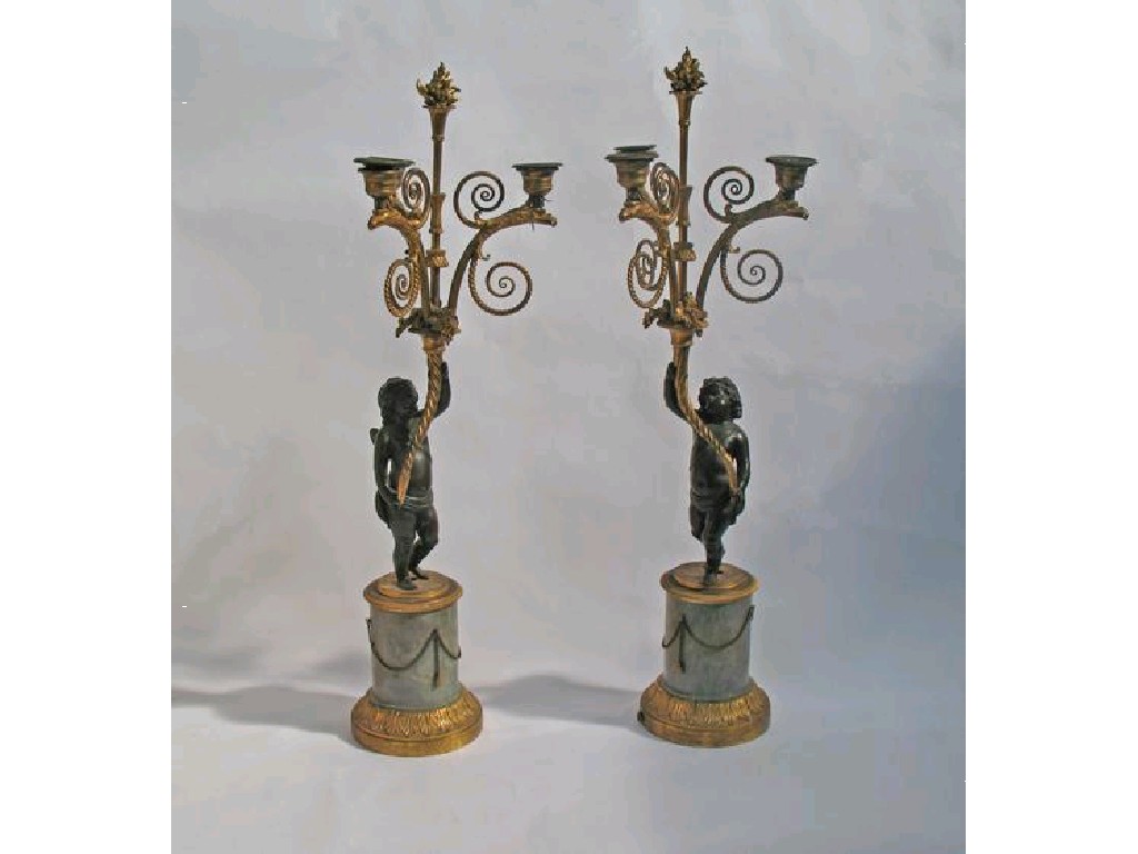 Appraisal: A PAIR OF LOUIS XVI STYLE BRONZE AND ORMOLU-MOUNTED CANDELABRA