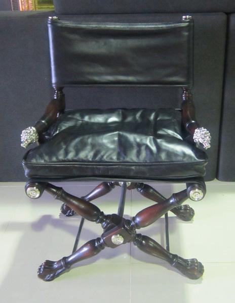 Appraisal: A BLACK LEATHER BUTTON BACK DIRECTORS CHAIR WITH CHROME MOUNTS