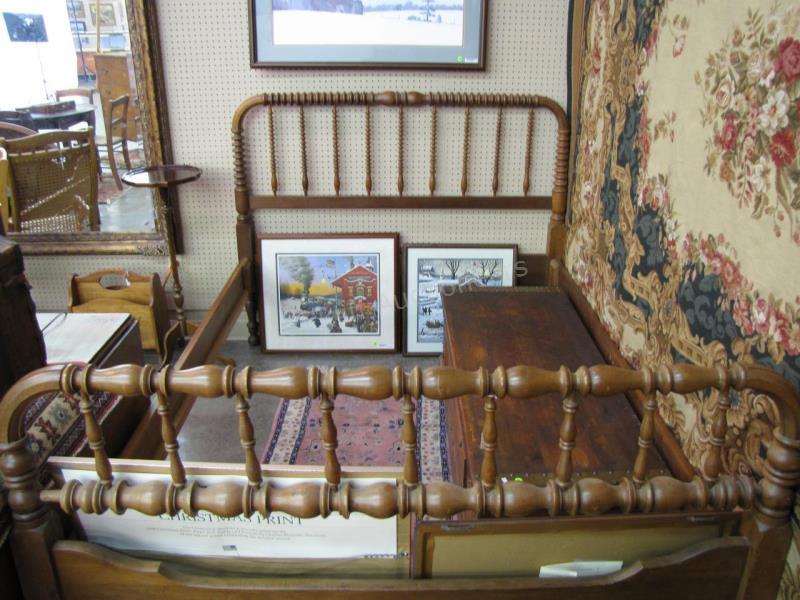 Appraisal: An antique full size bed walnut with different spindles on