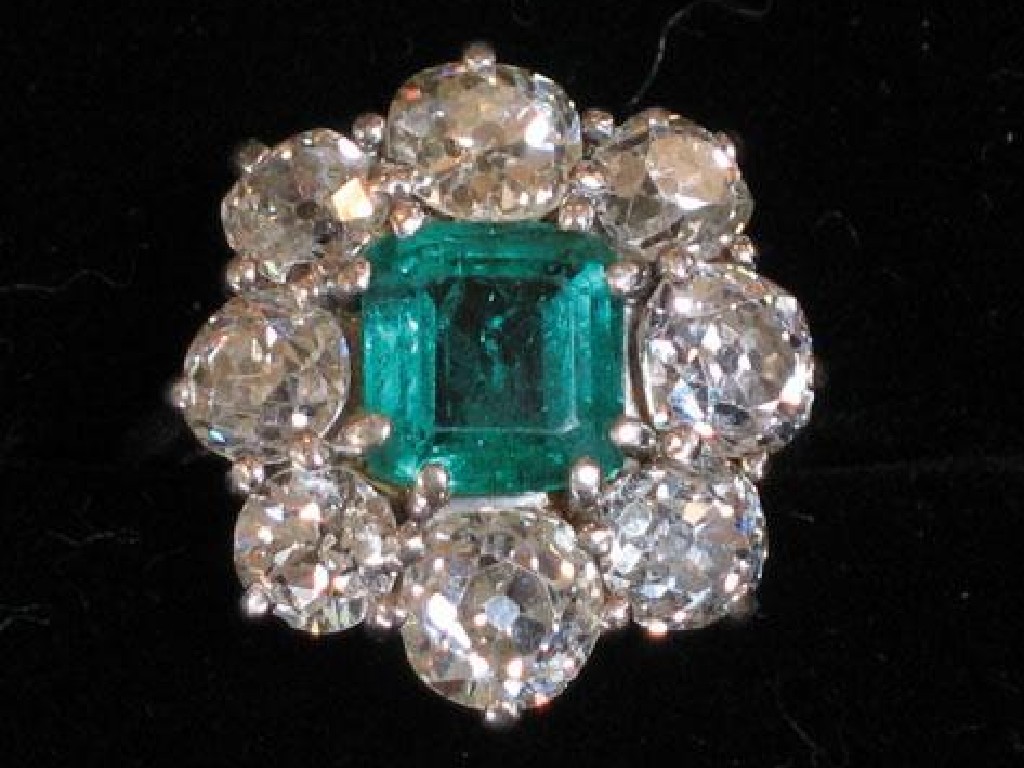 Appraisal: AN EMERALD AND DIAMOND RING the central square-cut emerald of