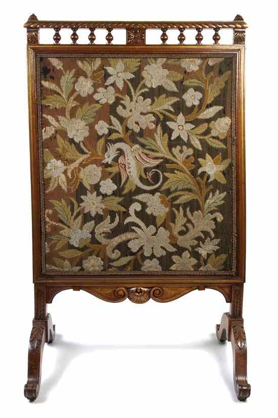 Appraisal: An English Oak and Needlepoint Firescreen having a carved spindled