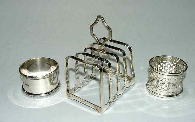 Appraisal: A SILVER FOUR DIVISIONAL TOAST RACK with carrying handle high