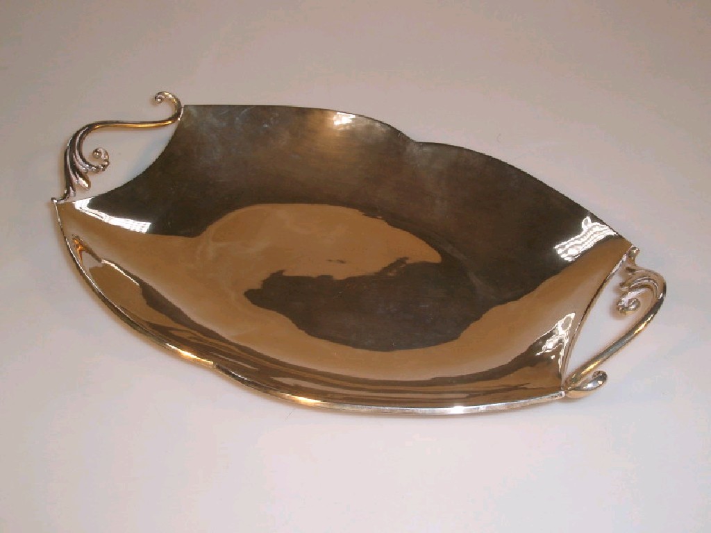 Appraisal: A Mexican white metal tray of dished form with two