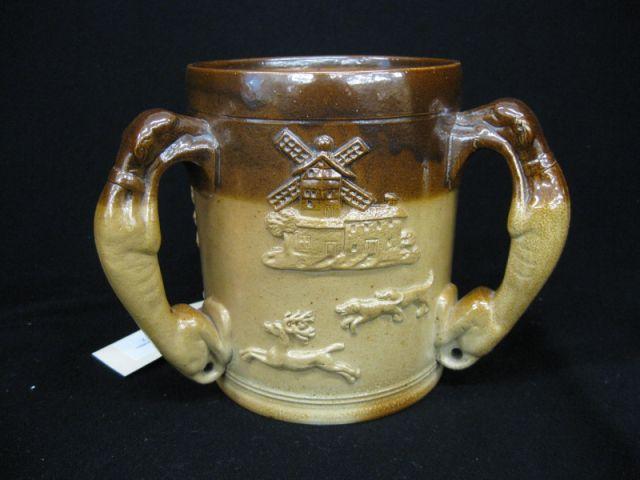 Appraisal: English Stoneware Loving Cup fox hound decor with figural hound