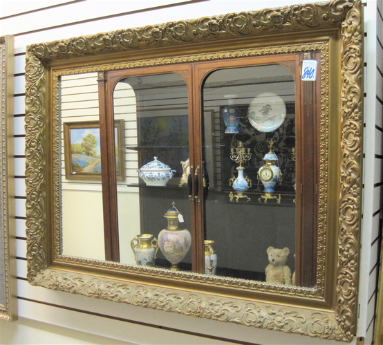 Appraisal: AN AMERICAN RECTANGULAR WALL MIRROR in heavy and wide gilt