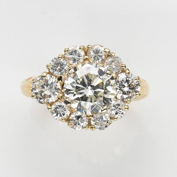 Appraisal: A diamond and fourteen karat gold ring center diamond weighing