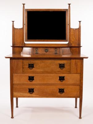 Appraisal: An Art Nouveau oak dressing table retailed by Maple Co