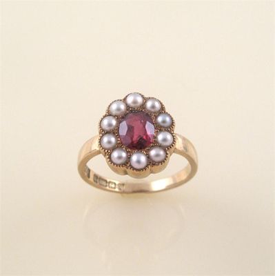 Appraisal: A garnet and half pearl cluster ring set in ct