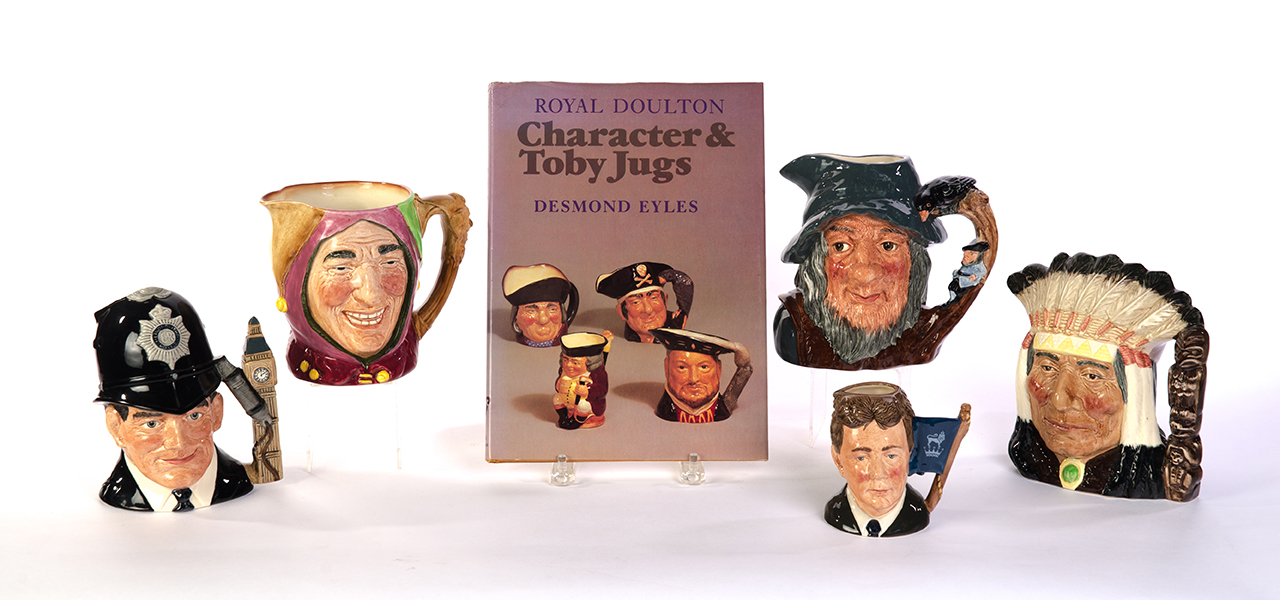 Appraisal: FIVE ROYAL DOULTON CHARACTER JUGS AND THE CHARACTER JUG BOOK