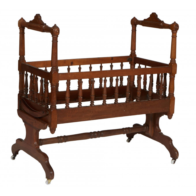 Appraisal: American Victorian Carved Walnut Baby Cradle th c the arched