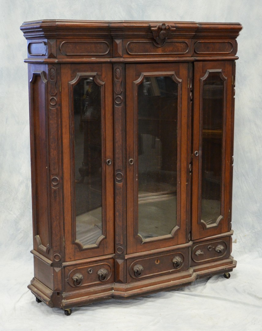 Appraisal: Small walnut Victorian door bookcase with drawers in base paneled