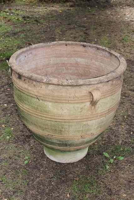 Appraisal: A LARGE TERRACOTTA PLANT POT with fluted and sgraffito decoration