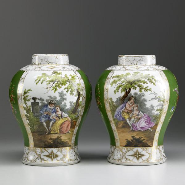 Appraisal: EUROPEAN PORCELAIN Pair of urns with missing lids crossed sword