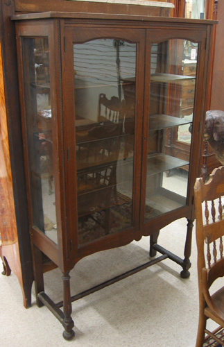 Appraisal: AN OAK AND GLASS CHINA DISPLAY CABINET American c 's