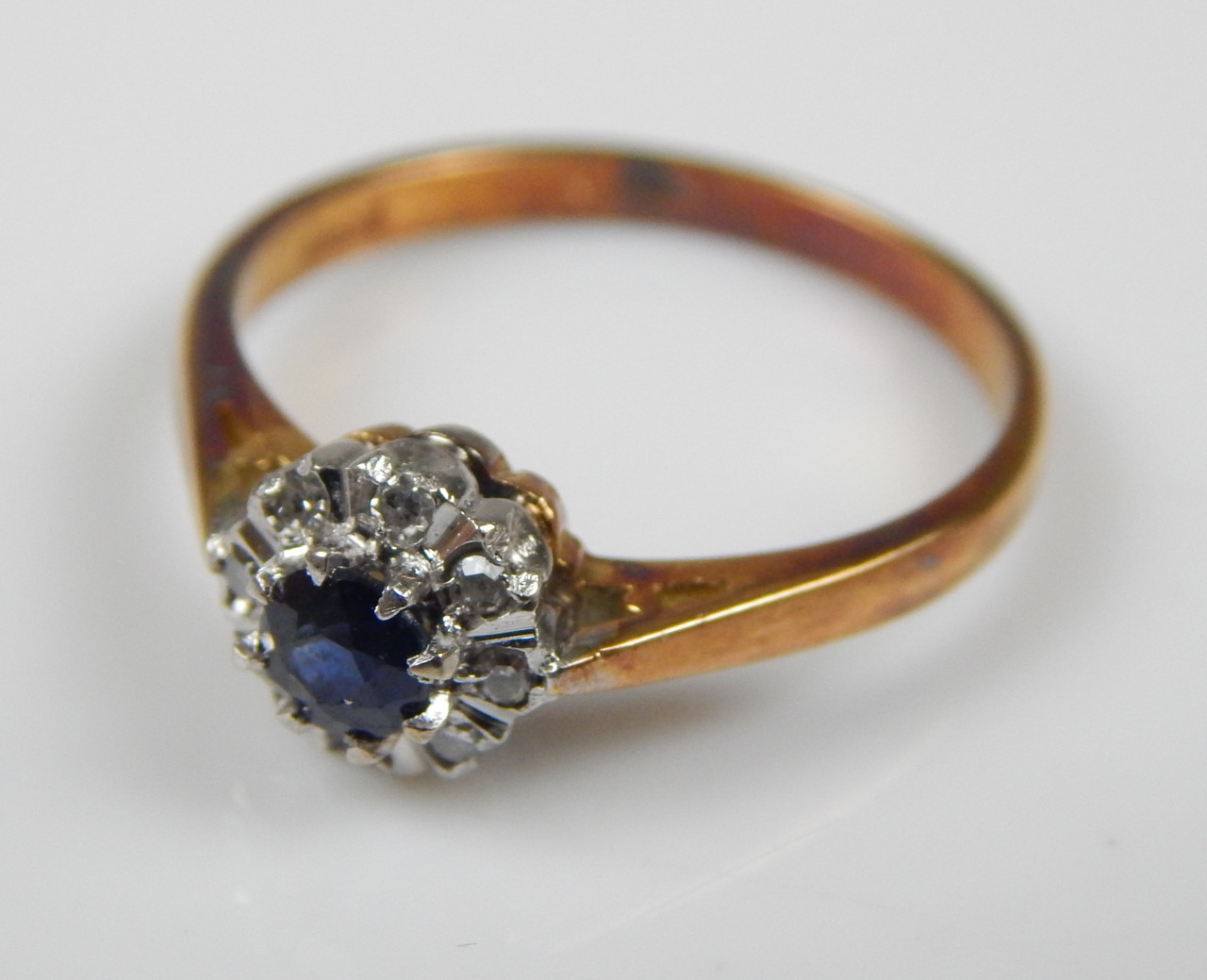 Appraisal: A floral cluster ring with sapphire and diamond yellow metal