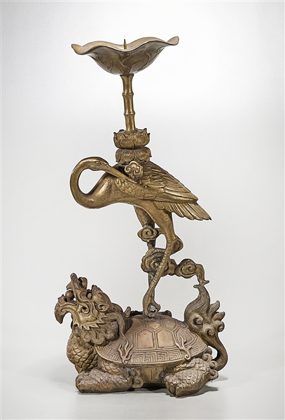 Appraisal: Chinese bronze candlestick in the form of a crane standing