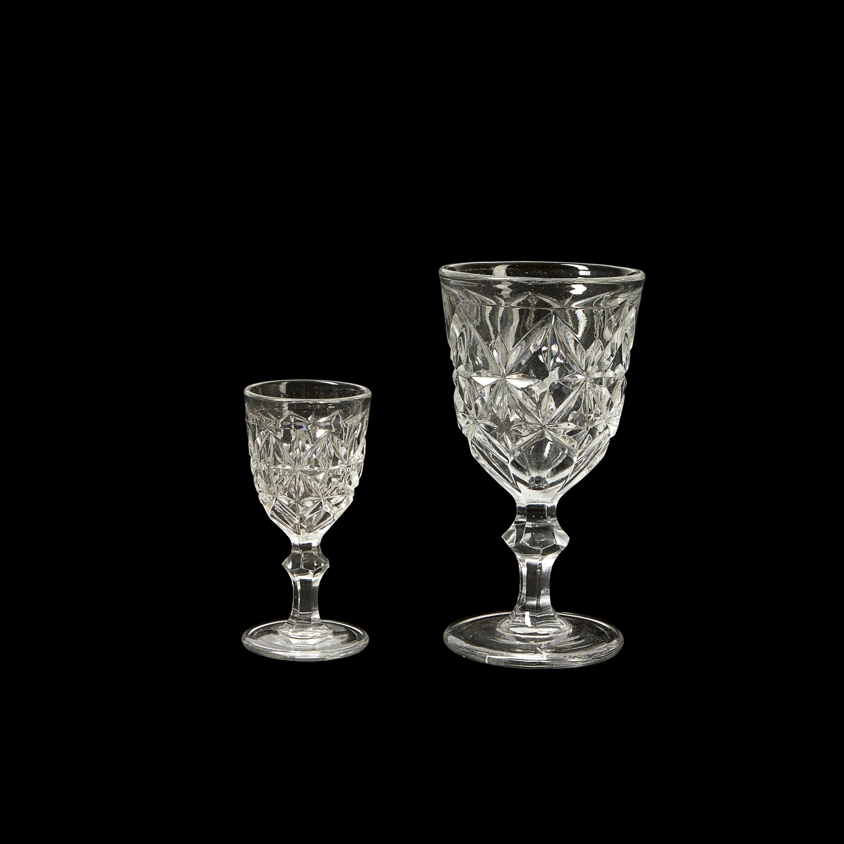 Appraisal: Early American Colorless Sandwich Star Pressed Glass Goblets and Wines