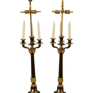 Appraisal: A Pair of Empire Style Ebonized and Gilt Bronze Four-Light