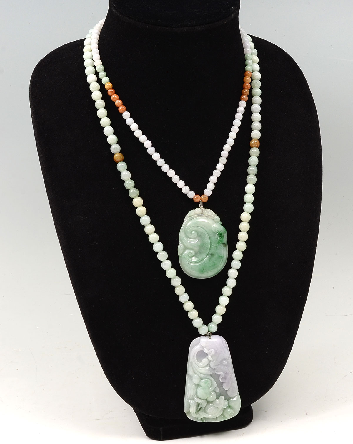 Appraisal: CHINESE JADE JADEITE NECKLACES Chinese carved Jadeite pendant with goldfish