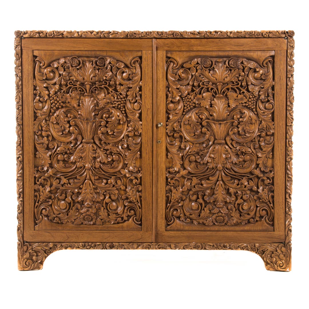 Appraisal: Chinese carved teakwood desk th century flat top with floral