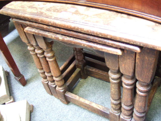 Appraisal: A th century oak nest of three occasional tables on