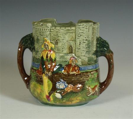 Appraisal: A Royal Doulton 'A Wandering Minstrel' pattern loving cup with