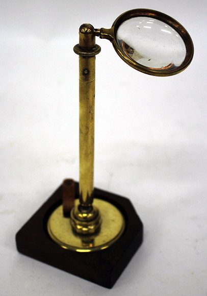 Appraisal: A BRASS MICROSCOPE LIGHT MAGNIFIER on turned brass support and