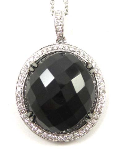 Appraisal: BLACK DIAMOND AND WHITE GOLD PENDANT NECKLACE the pendant is