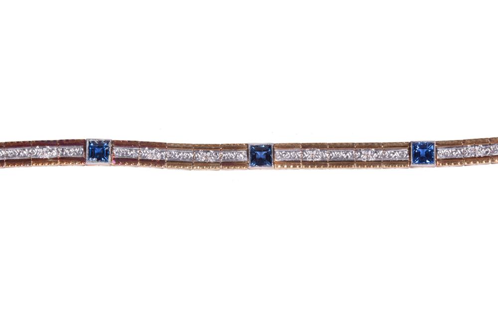 Appraisal: KT YELLOW AND WHITE GOLD AND SAPPHIRE LINE BRACELET kt