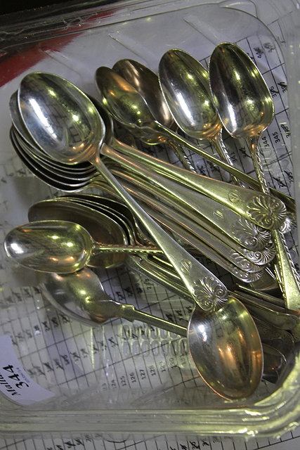 Appraisal: A SET OF NINE SILVER SHELL PATTERN TEA SPOONS monogrammed