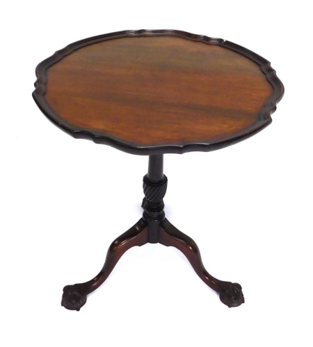 Appraisal: An early thC mahogany tripod table the piecrust top on