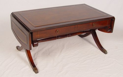 Appraisal: MAHOGANY LEATHER TOP COFFEE TABLE Drop leaf ends stretcher base