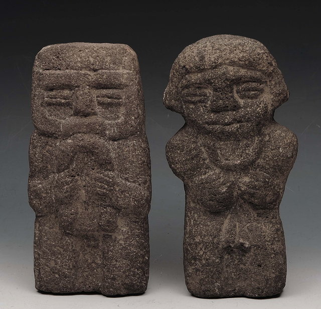 Appraisal: TWO OCEANIC CARVED STONE TRIBAL FIGURES cm high