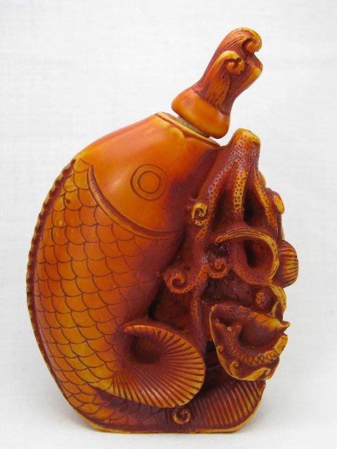 Appraisal: Carved Koi fish snuff bottle Fish is swimming through lily