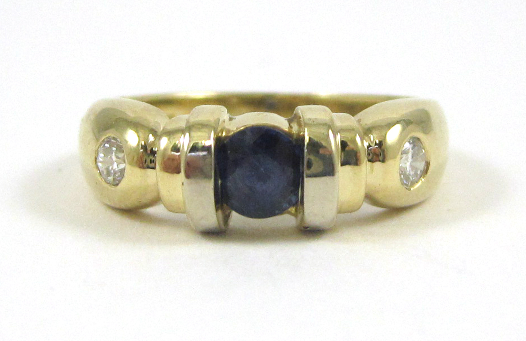 Appraisal: SAPPHIRE DIAMOND AND FOURTEEN KARAT GOLD RING set with two