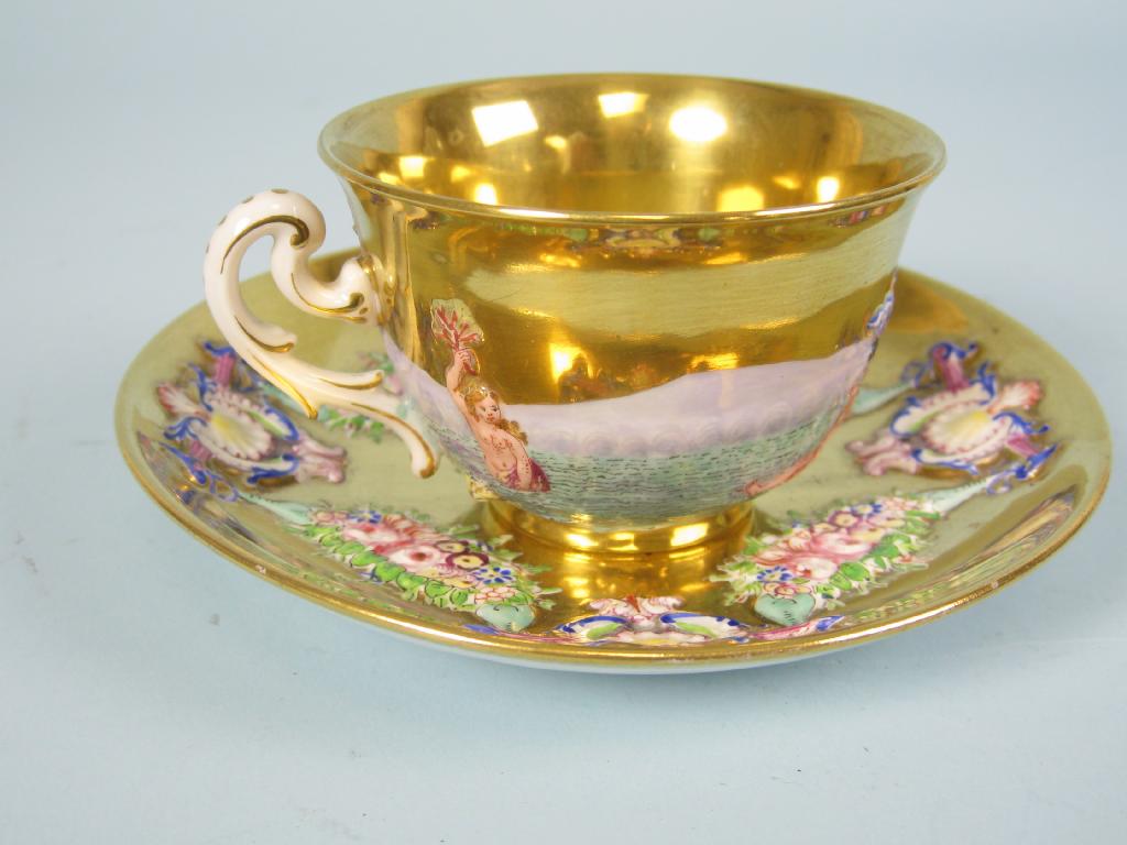 Appraisal: A Naples Capo di Monte Cup and Saucer the cup