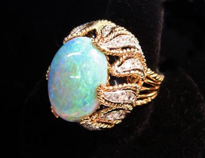 Appraisal: karat yellow gold and opal ring Large oval cabochon opal