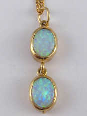 Appraisal: A carat gold opal pendant necklace pendant drop approx cm