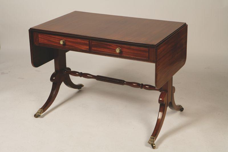 Appraisal: A REGENCY MAHOGANY SOFA TABLE with a rectangular top with