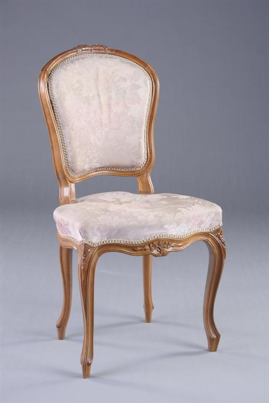 Appraisal: LOUIS XV STYLE SIDE CHAIR th century fruitwood Floral-carved crest