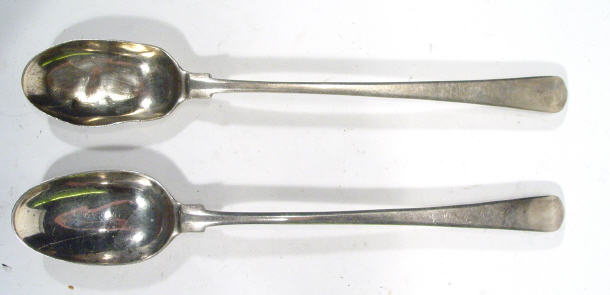 Appraisal: Two silver metal long handled serving spoons indistinctly hallmarked cm