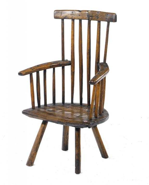 Appraisal: A BRITISH PRIMITIVE ASH COMB BACK CHILD'S CHAIR with elm