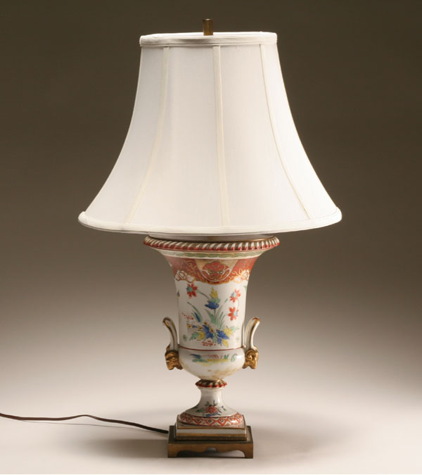 Appraisal: French hand painted and gilt porcelain lamp urn form lamp