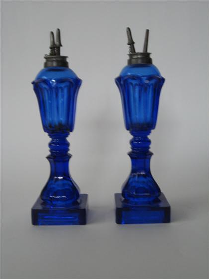 Appraisal: Pair of cobalt blue loop pattern pressed glass fluid lamps