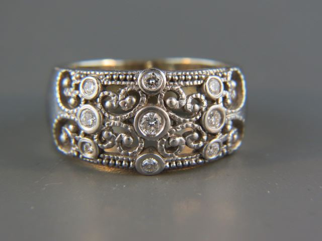 Appraisal: Diamond Ring diamonds in fancy openwork wide band k white